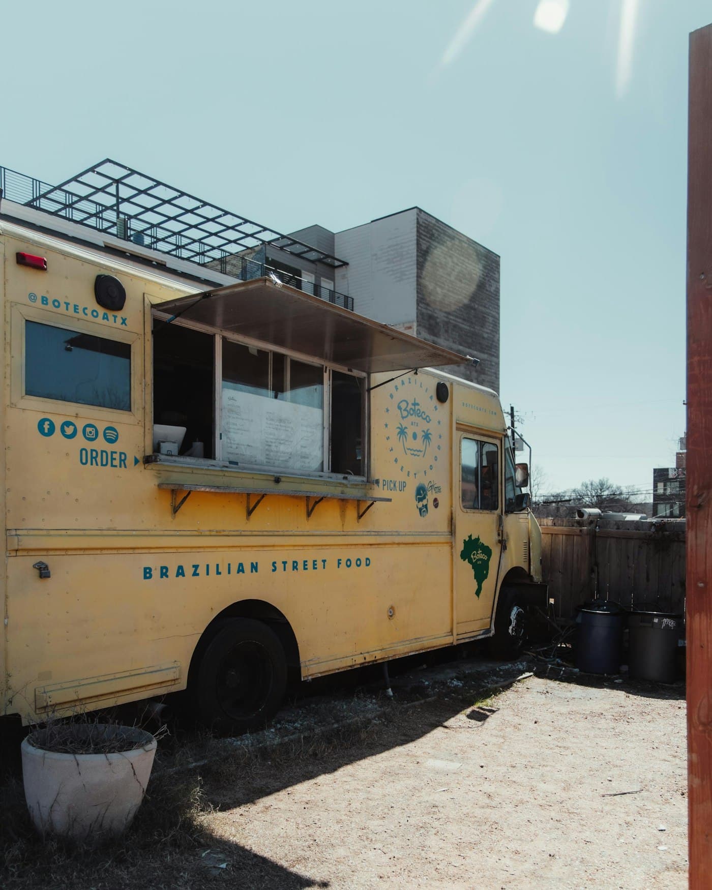 A contemporary food truck open for service at an outdoor run